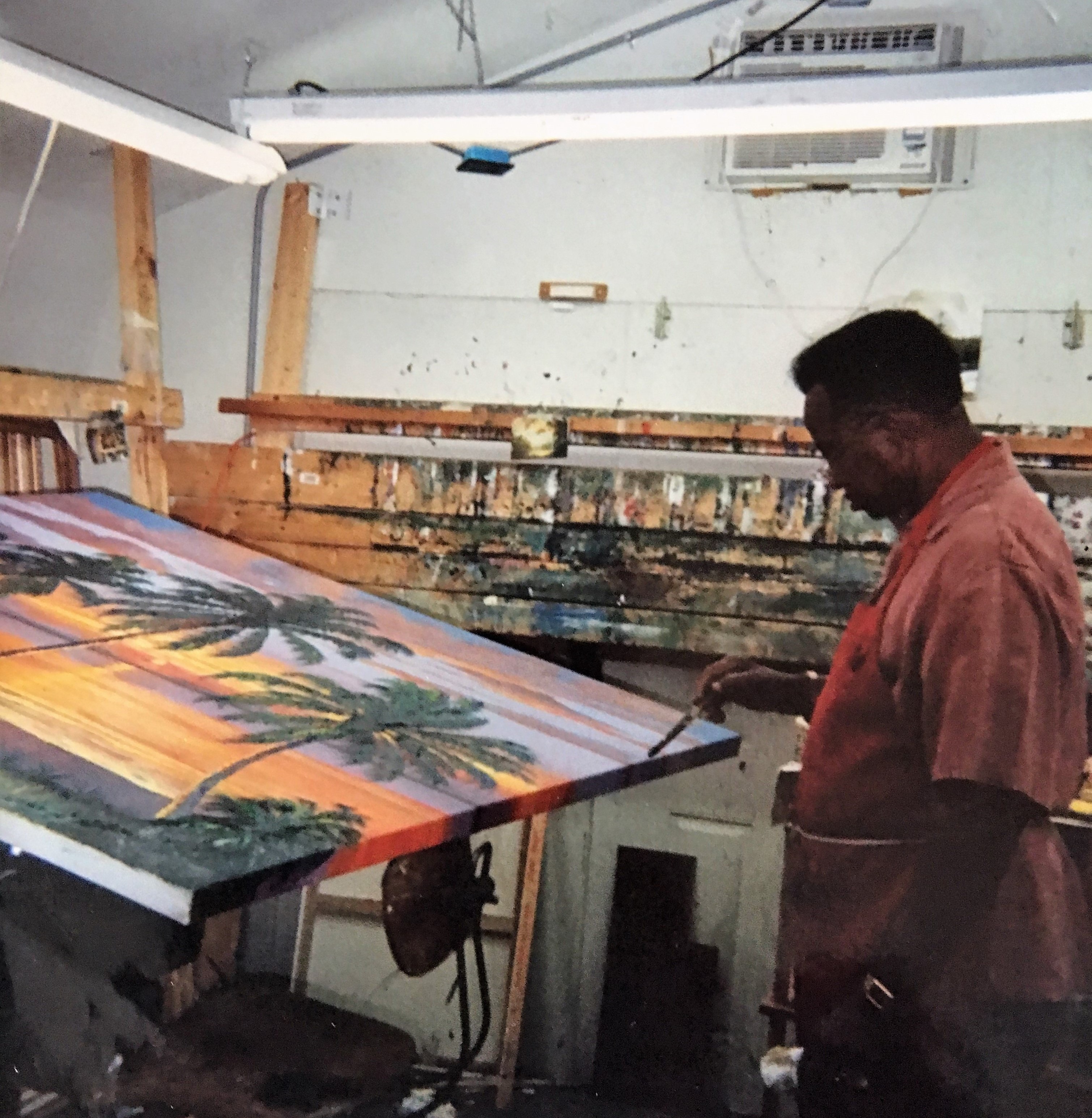 Florida Highwaymen James Gibson teaches AJ Brown to paint in his makeshift studio, was for Florida's Governor Charlie Crist, in January 2008   